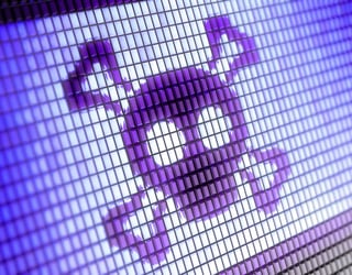 Tête de mort violet pixelisée avec os croisés affichée sur un écran numérique.